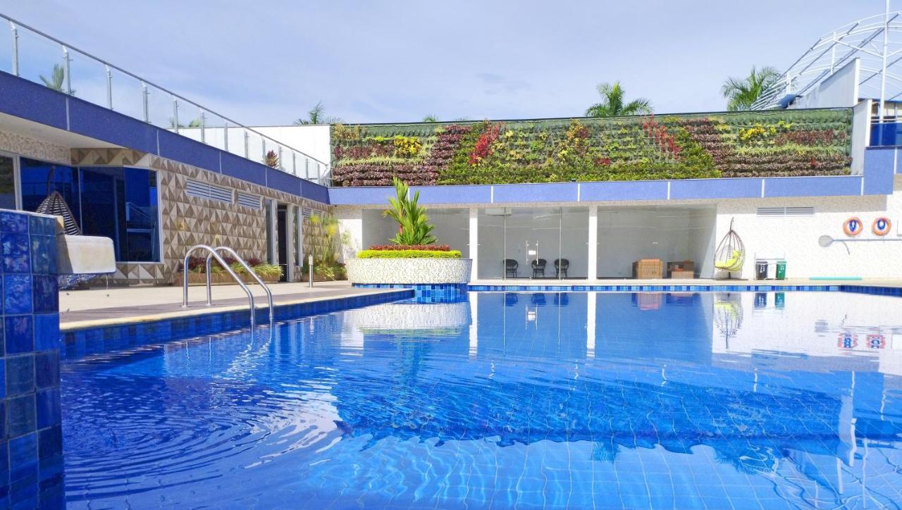 Hotel Royal Elim International Cali Exteriör bild The swimming pool at the hotel