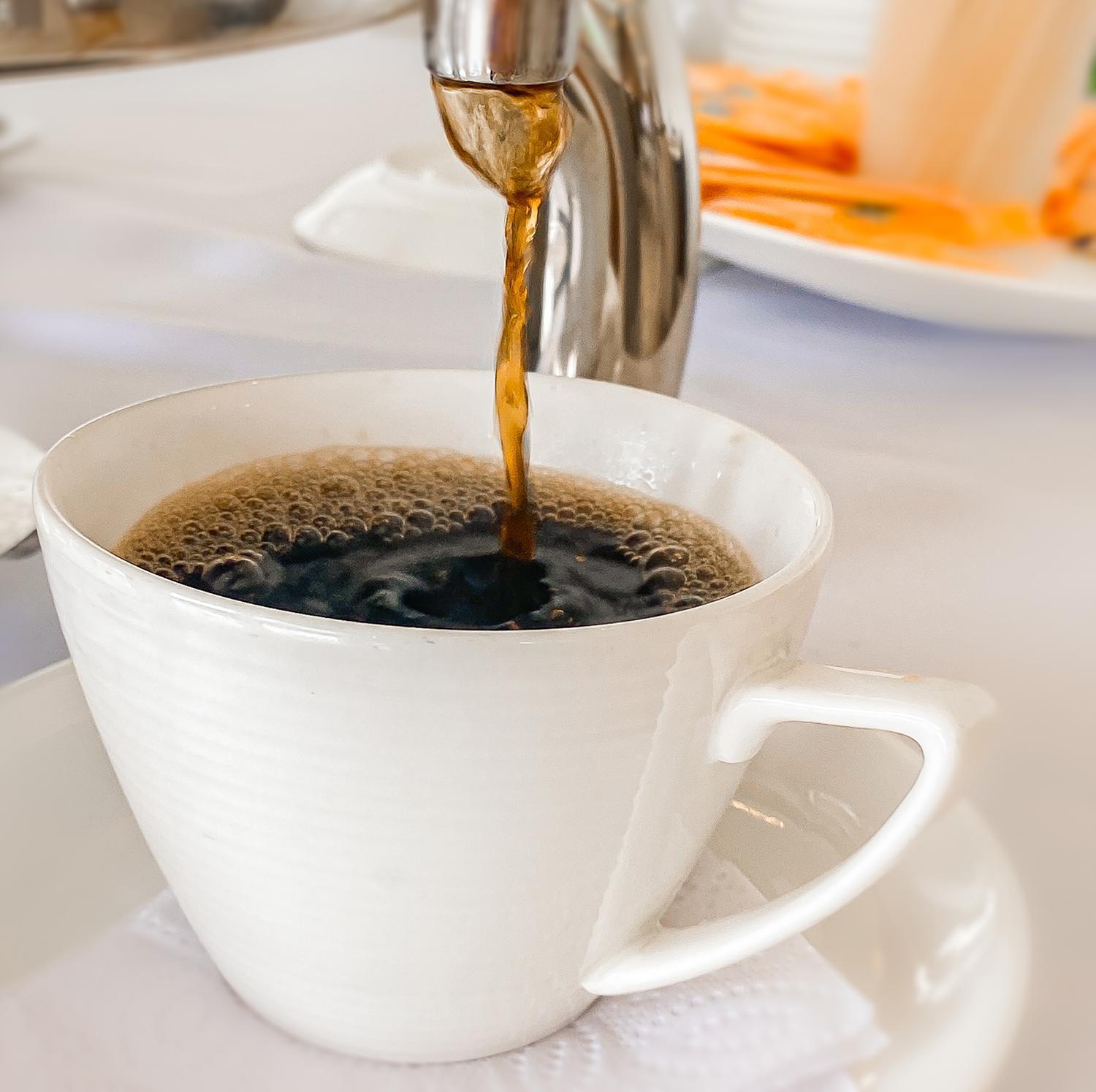 Hotel Royal Elim International Cali Exteriör bild Coffee being poured