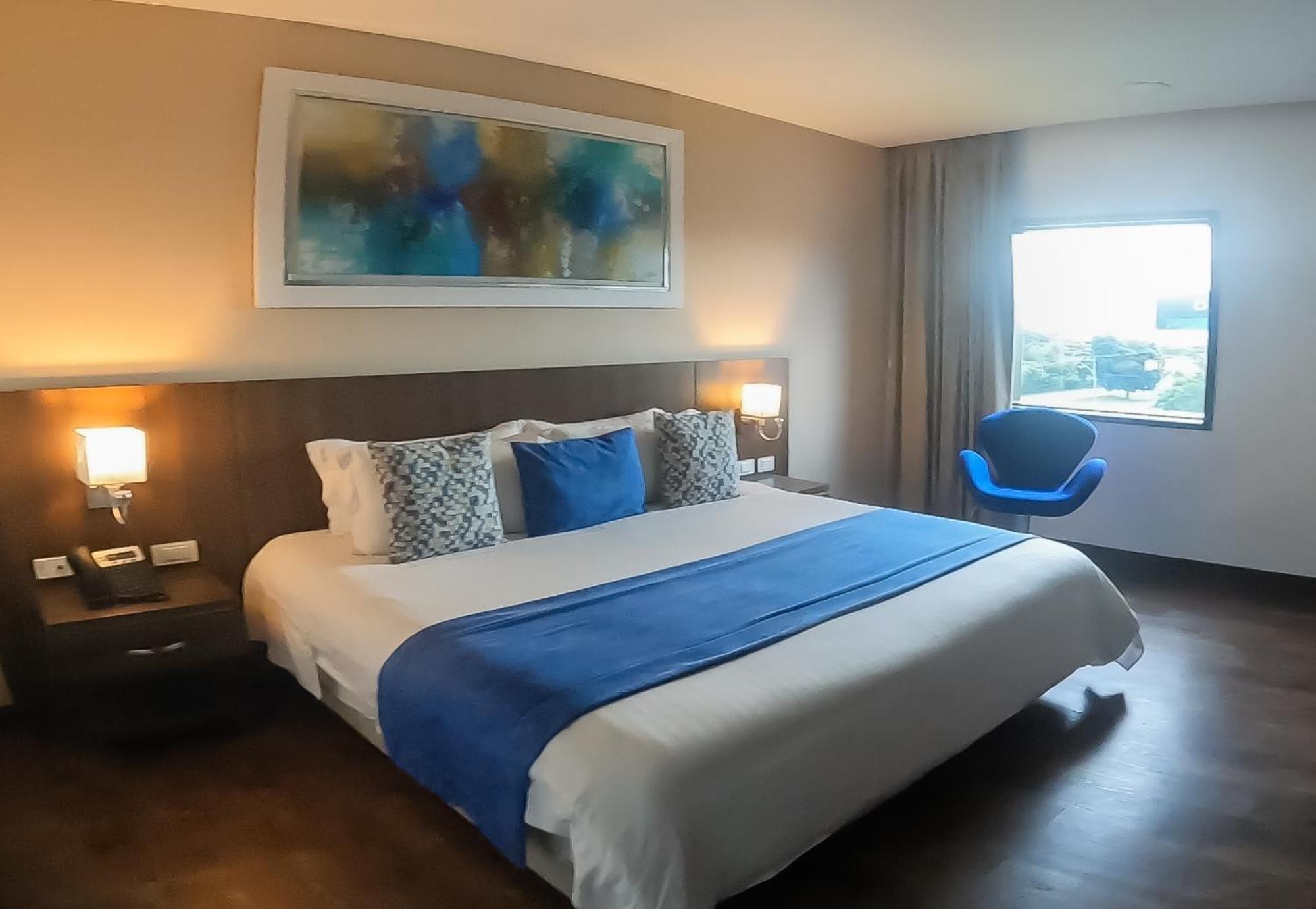 Hotel Royal Elim International Cali Exteriör bild A room at the hotel