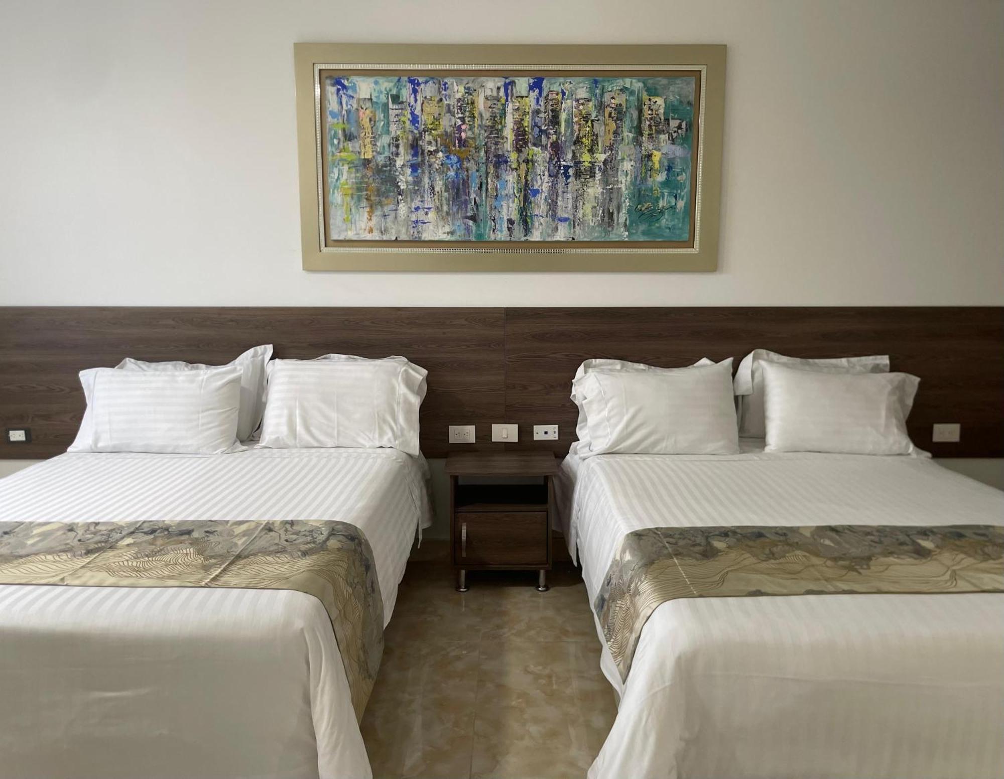 Hotel Royal Elim International Cali Exteriör bild A room at the hotel